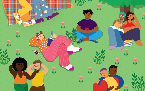 A young person sits in the park enjoying themselves surrounded by couples