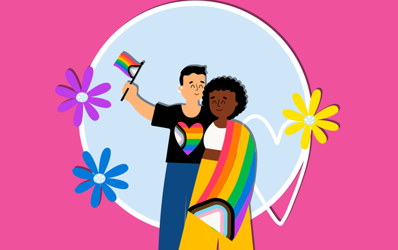 A young couple embrace each other wearing the pride flag