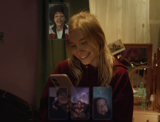 A young girl texts her friends.