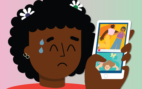 A young person looks distressed looking at their social media feed