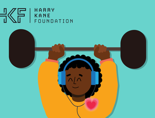 A young person listens to music through their headphones while lifting a weight.