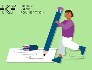 A young person scribbles on a giant piece of paper.