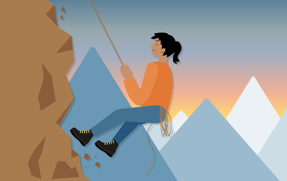 A young person climbs a mountain.